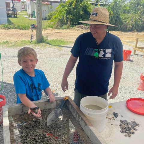 Leo Fitzgerald et al. that are standing in the dirt